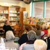 A rapt audience listens to Laura speak at Buttonwood Books.